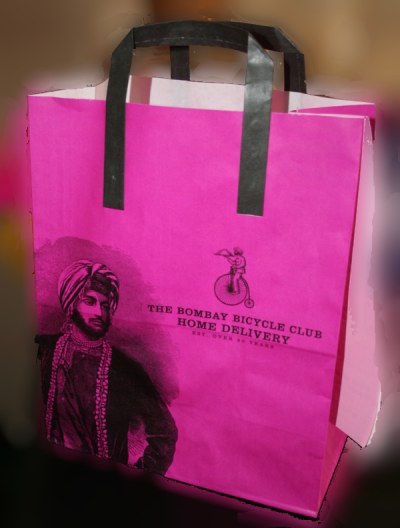 pink paper bag Bicycle Club restaurant
