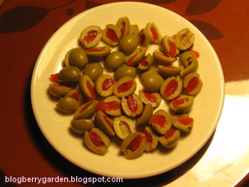 cut green pimento almond olives plate